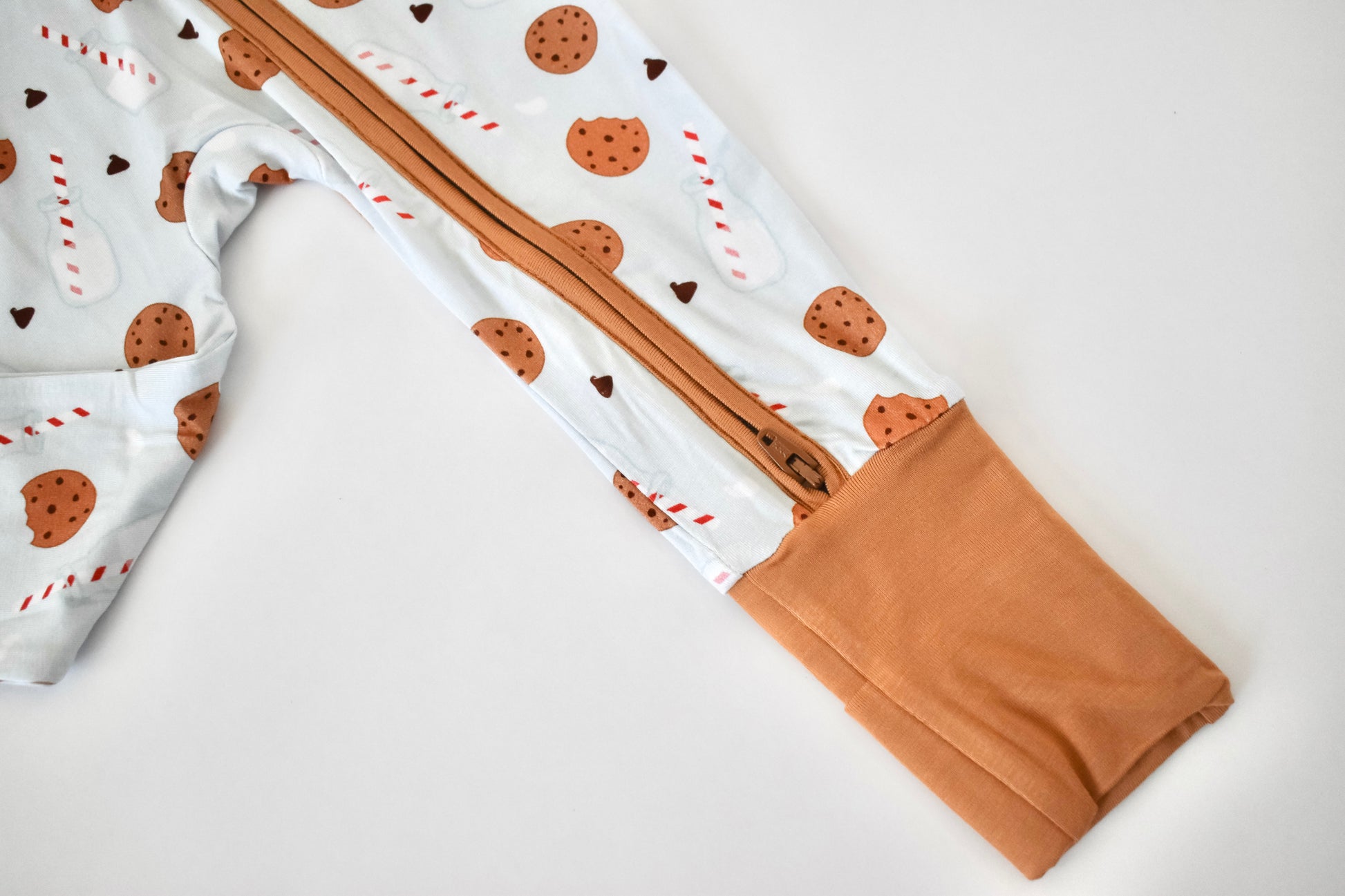 Convertible baby pajama with fold over hand mittens and feet cuffs