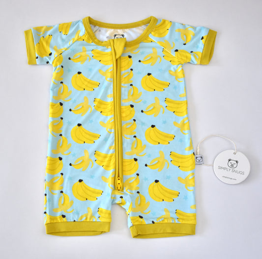Baby bamboo pajama with banana pattern on a light blue background