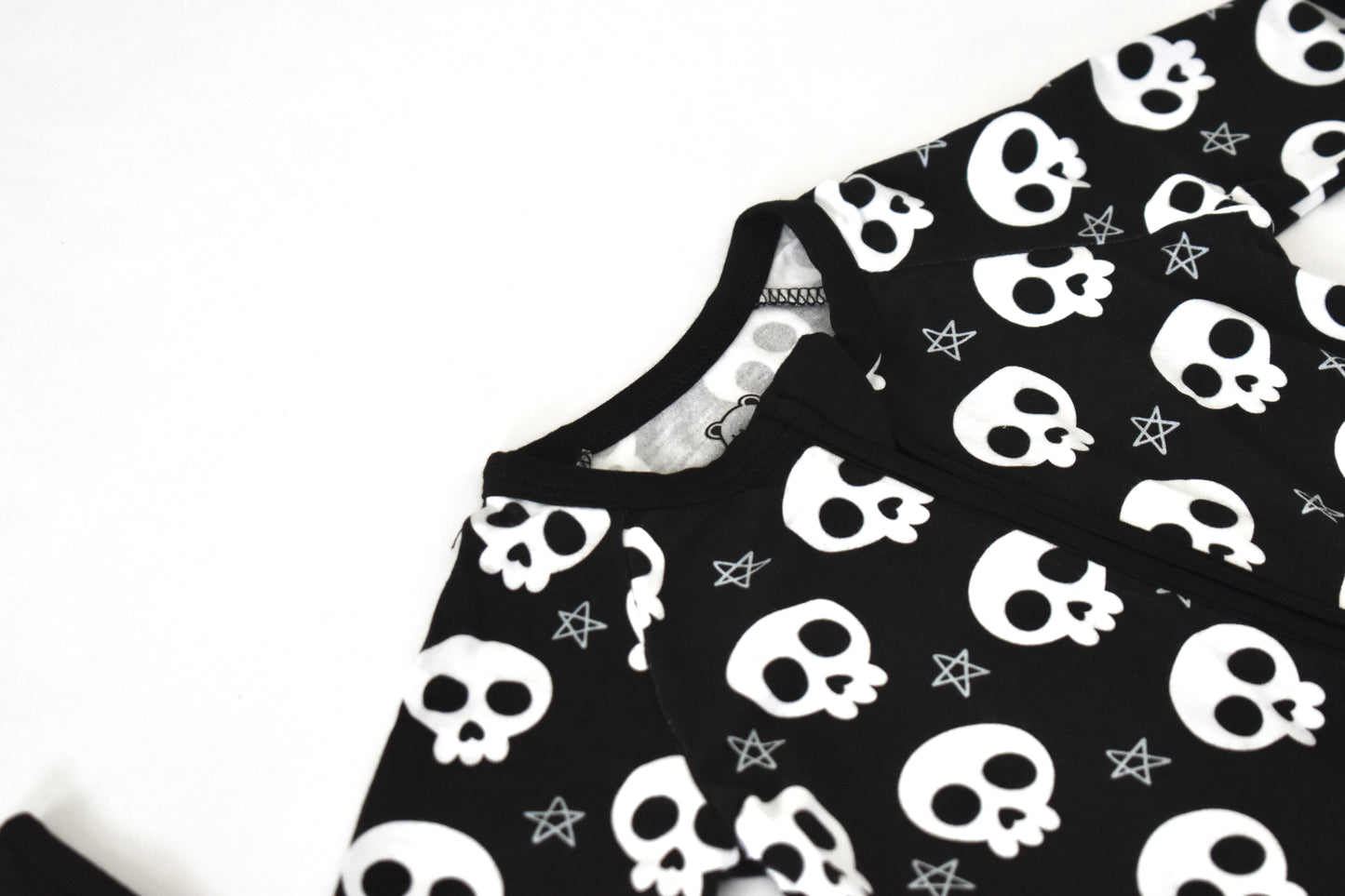Black fabric with white skull pattern