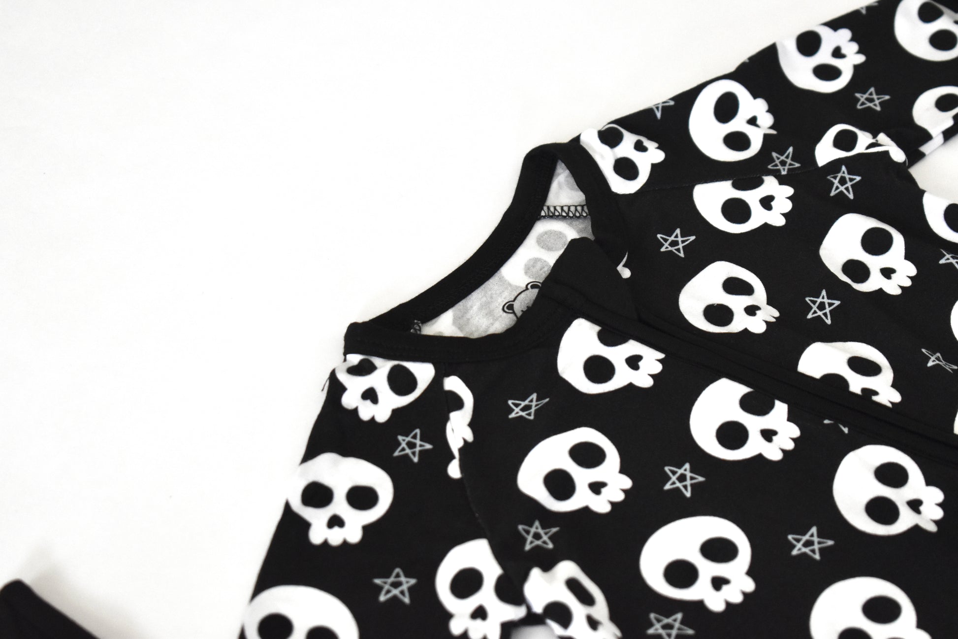 Black fabric with white skull pattern
