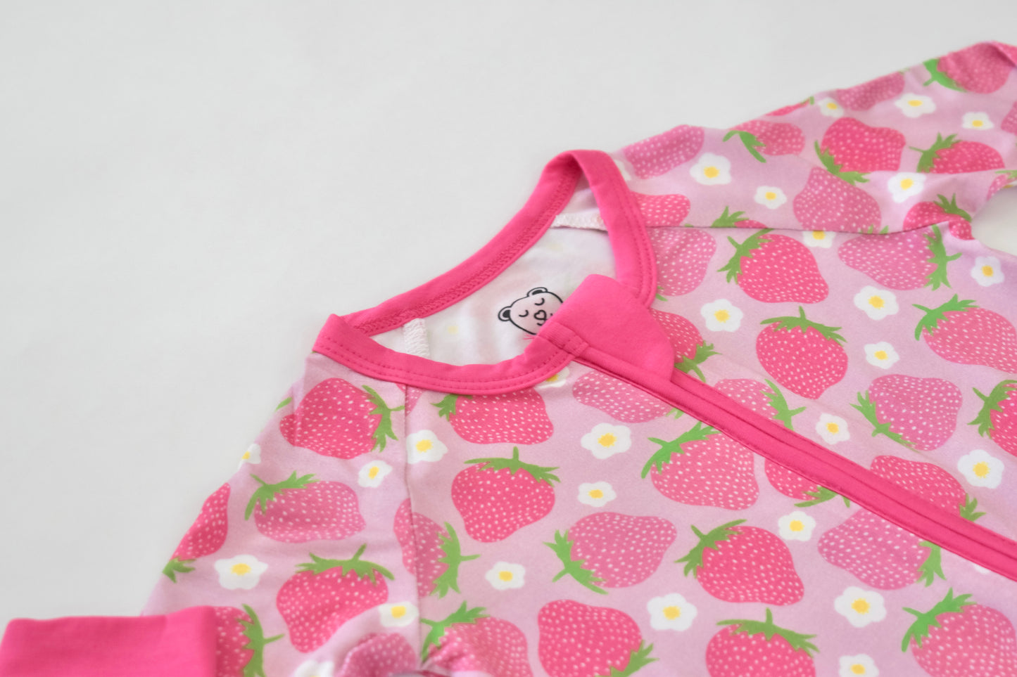 Hypoallergenic baby pajama with pink strawberry print